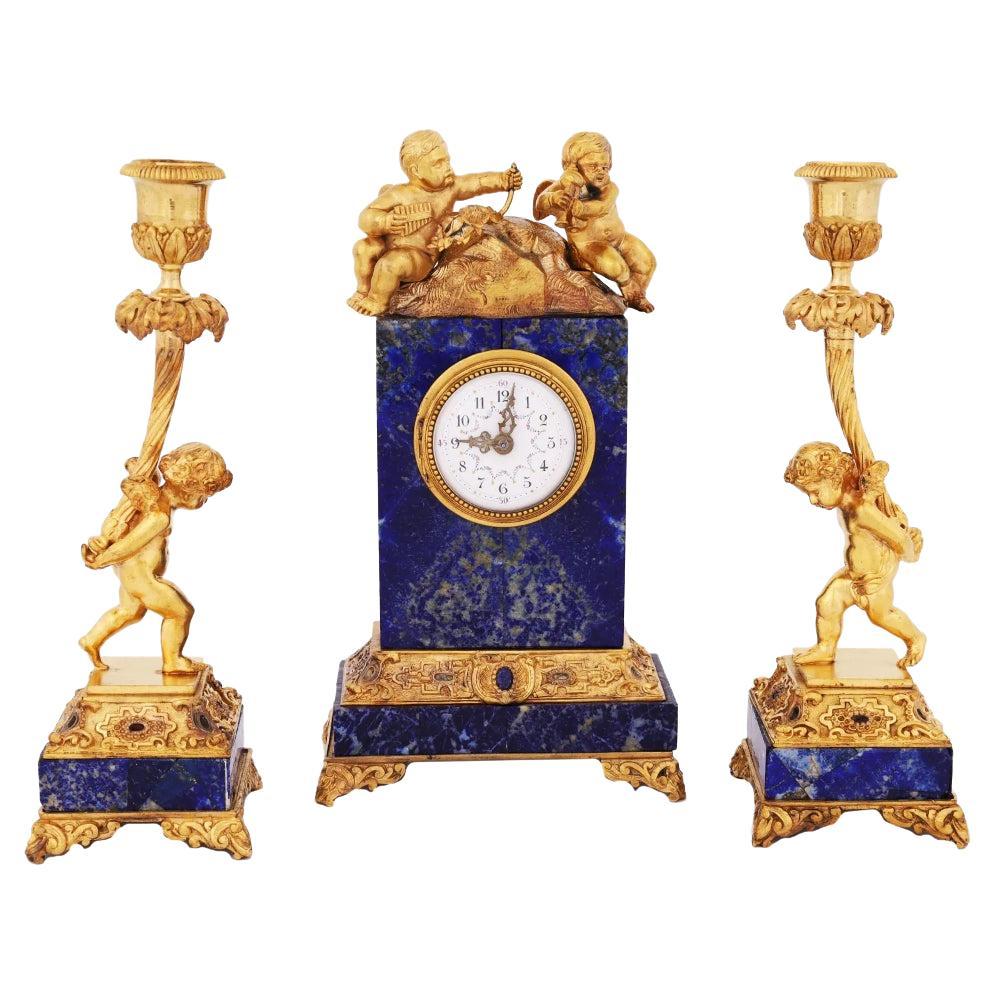 19th Century French Lapis and Ormolu Clock and Candlesticks with Cherubs For Sale