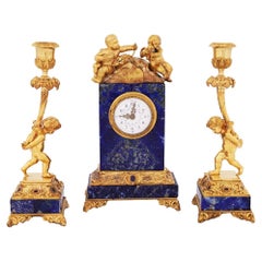 19th Century French Lapis and Ormolu Clock and Candlesticks with Cherubs