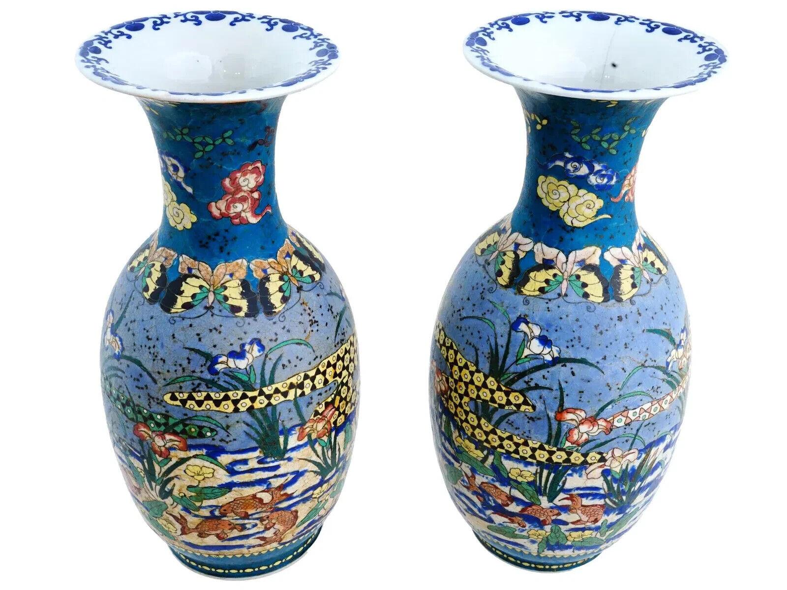 A pair of Japanese covered Totai enamel on porcelain vases. The wares are enameled with a polychrome design representing fish in the pond with flowers and plants made in the Cloisonne technique. The necks are adorned with cloud, foliage and