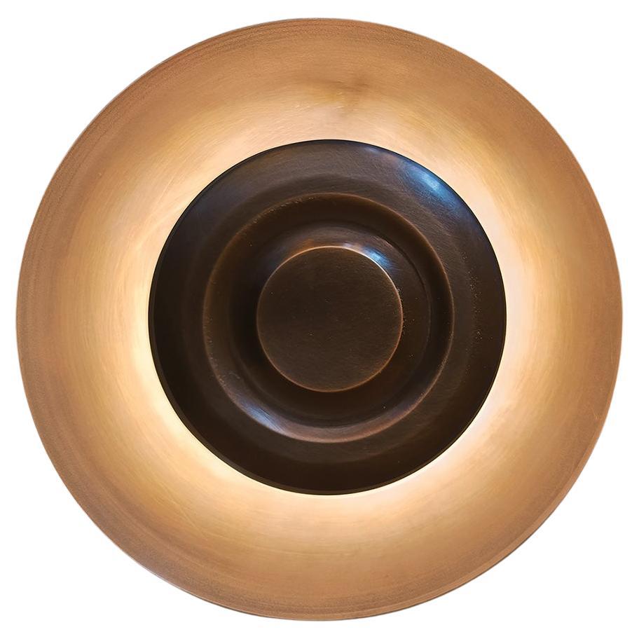 CONE is made of hand spun solid brass elements. Soft light emits from under solid brass plate.
Finished and assembled by hand.
CONE can be customized on request.

Lamping: integrated LED, 3000K, 50 000 hours, 12V

Various brass finishes (aged brass,