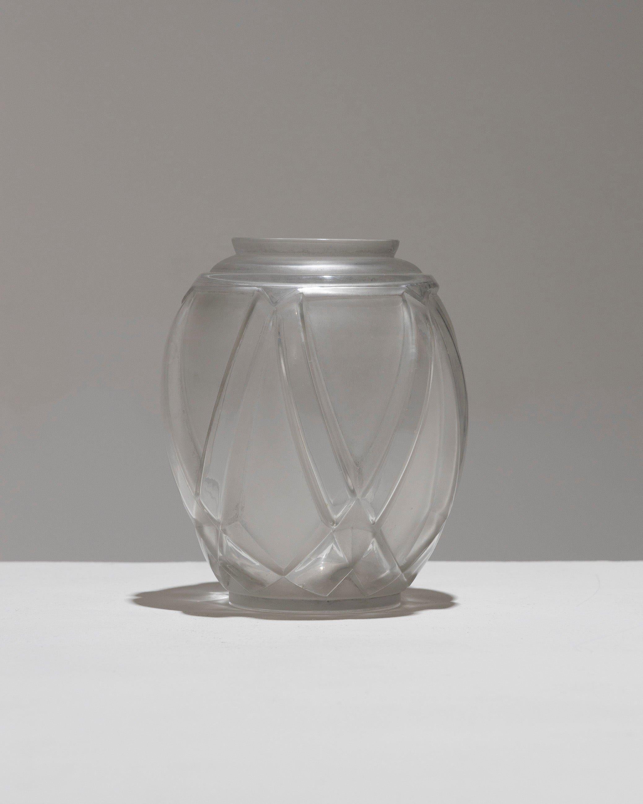 Ovoid Molded Frosted Glass Vase by French Glassmaker André Hunebelle, in the Art Deco Style of the 1930s. The body is adorned with raised transparent geometric motifs: diamond points rise from the base into rectangular bands that symmetrically