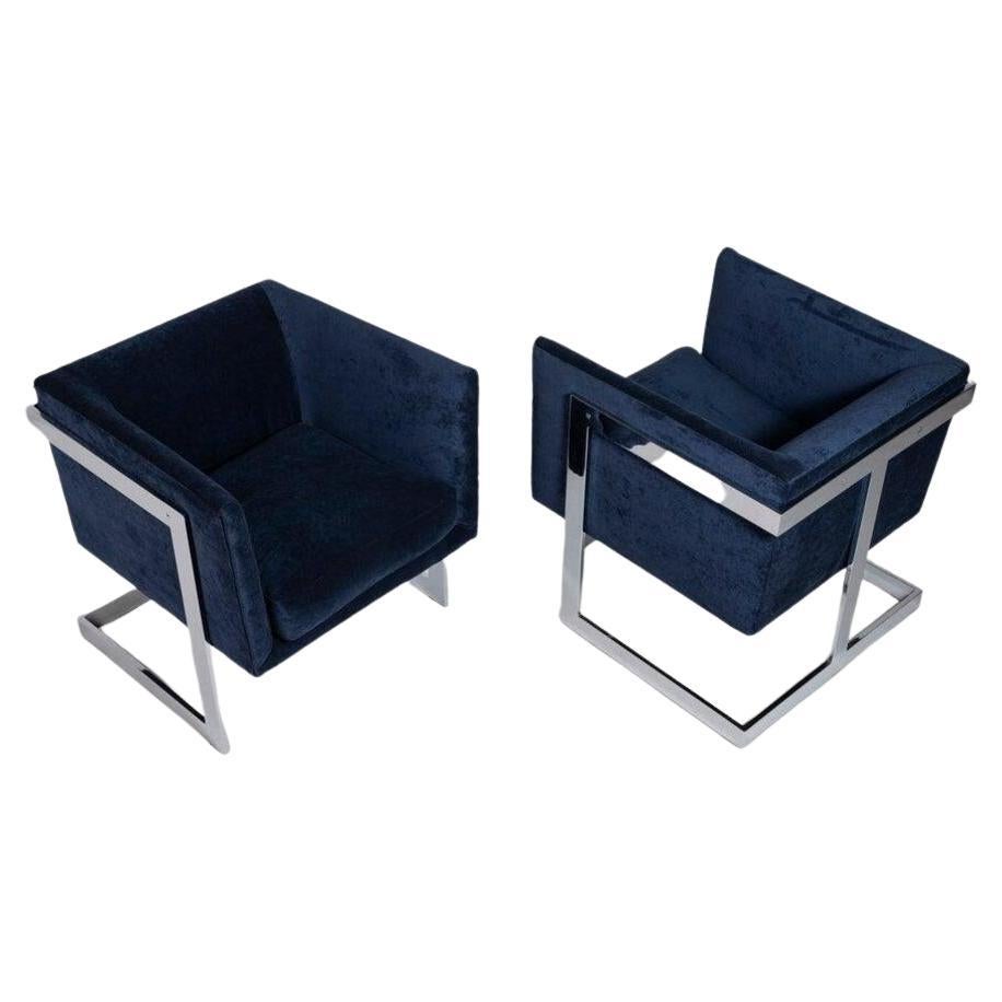 Stylish and comfy. This set of two cube club chairs are upholstered in a gorgeous navy blue velvet and set on a polished chrome base.

---Dimensions---
Width: 24 in / 60.96 cm
Depth: 25.5 in / 64.77 cm
Height: 27 in / 68.58 cm
Seat Height: 18 in /