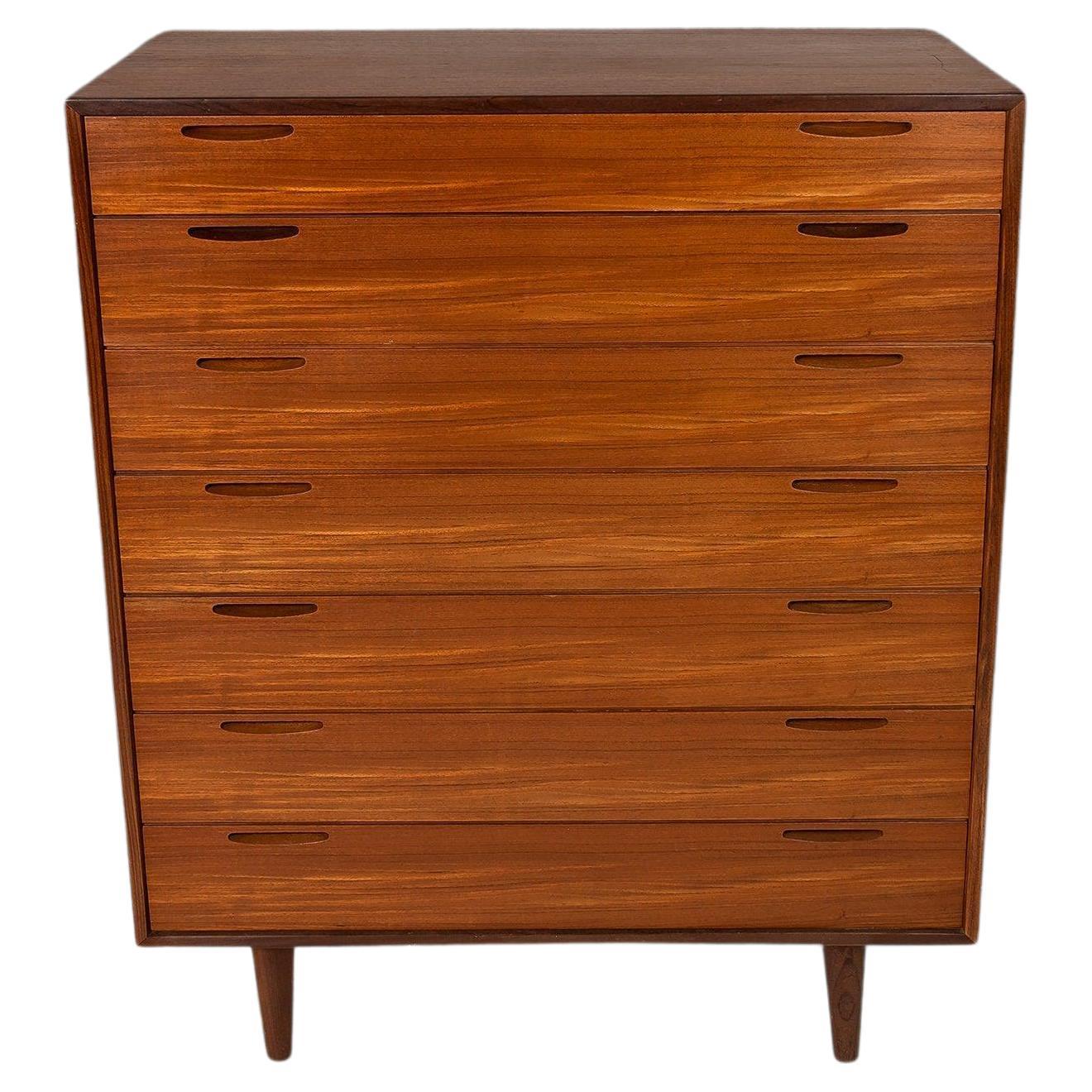 As rare as it is aesthetically pleasing this dresser by J. Clausen & Son Brande Mobelfabrik is the epitome of functional art. The details on this piece are exceptional with inset pulls, precise dovetail joints and matchbook teak veneer that are