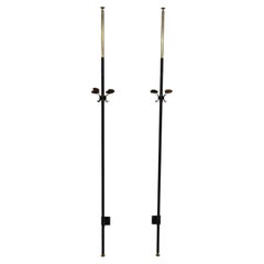 Pair of 1950s floor-to-ceiling coat racks made of iron and telescopic brass