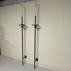 Pair of 1950s floor-to-ceiling coat racks made of iron and telescopic brass