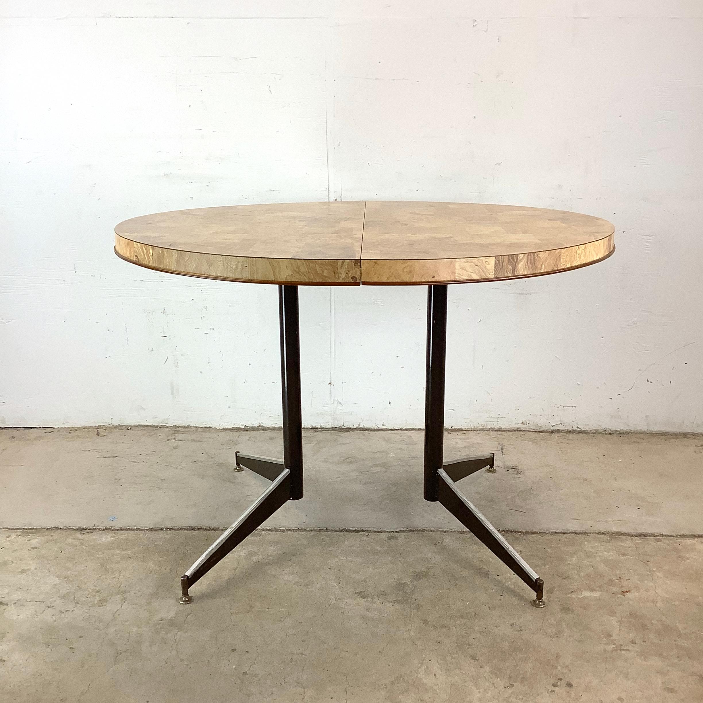 If you’re craving a vintage table that delivers mid-century style without taking over your space, this round Formica table is just the thing. With its warm faux wood top and splayed iron legs, it echoes the smart, compact design sensibilities of