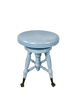 Tabouret de piano victorien ancien, peint en bleu, doté de roulettes à griffes et boules, fin du XIXe siècle.