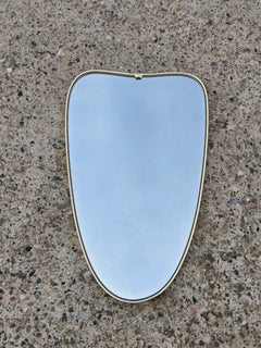 Mid Century Modern Brass framed wall mirror with beautiful shape, Italy 1950s