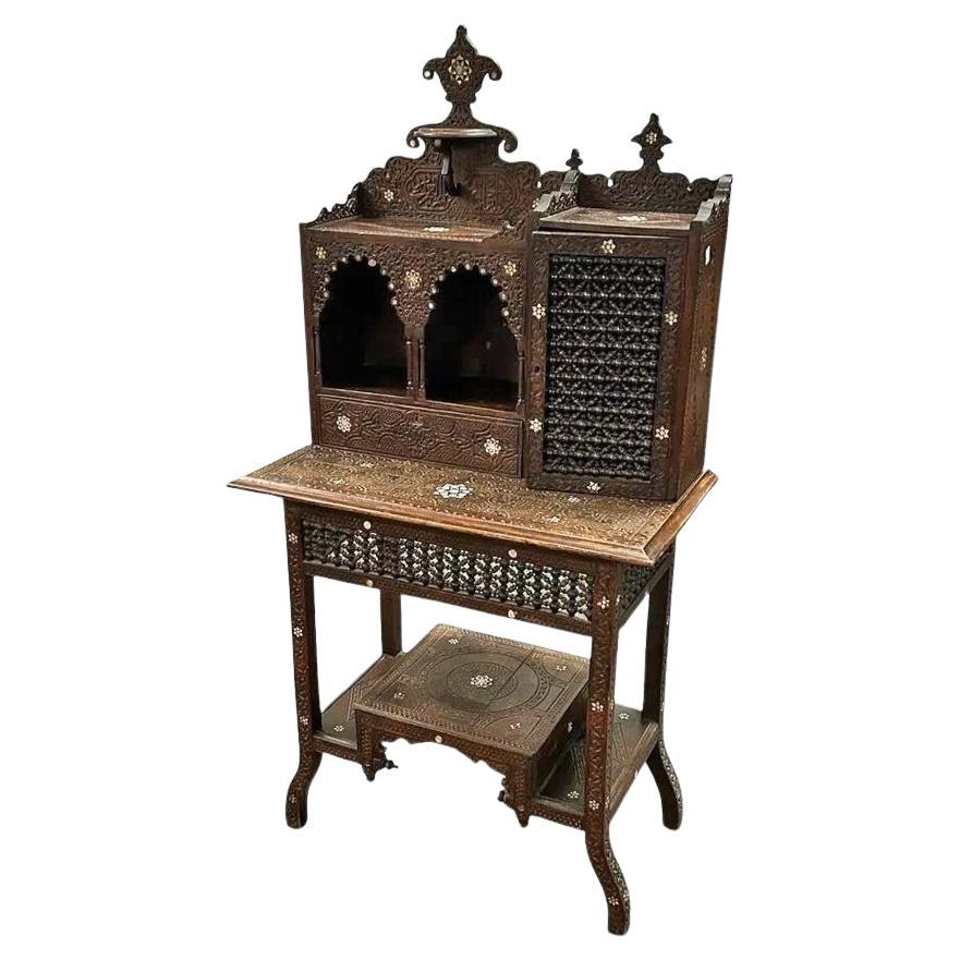 Oriental “Bonheur du jour” in carved wood, bone inlays, “Moucharabiehs”