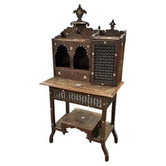 Oriental “Bonheur du jour” in carved wood, bone inlays, “Moucharabiehs”