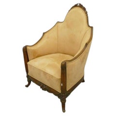large Art Deco armchair in carved walnut circa 1920/1930.