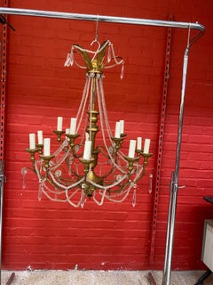 Large decorative chandelier in wood and wood and gilded iron, circa 1950.