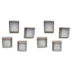 Important set of 16 sconces in cast aluminum lacquered and "holophane" glass.