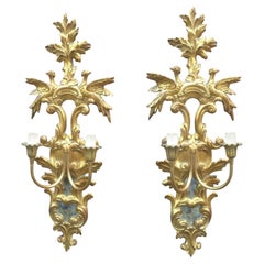Paire d' appliques italiennes en bois doré avec miroirs, vers 1950.