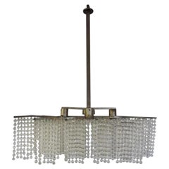Élégant lustre Art déco, composé de trois franges de perles et de métal