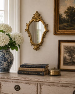 Italian Rococo Style Giltwood Wall Mirror with Carved Scrollwork Frame