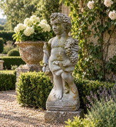 Neoclassical Cast Concrete Putto with Grapes Garden Statue