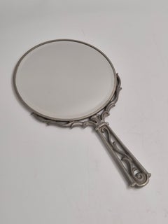 A Swedish Grace hand mirror in pewter with beautiful decor, Sweden 1937 (L8).