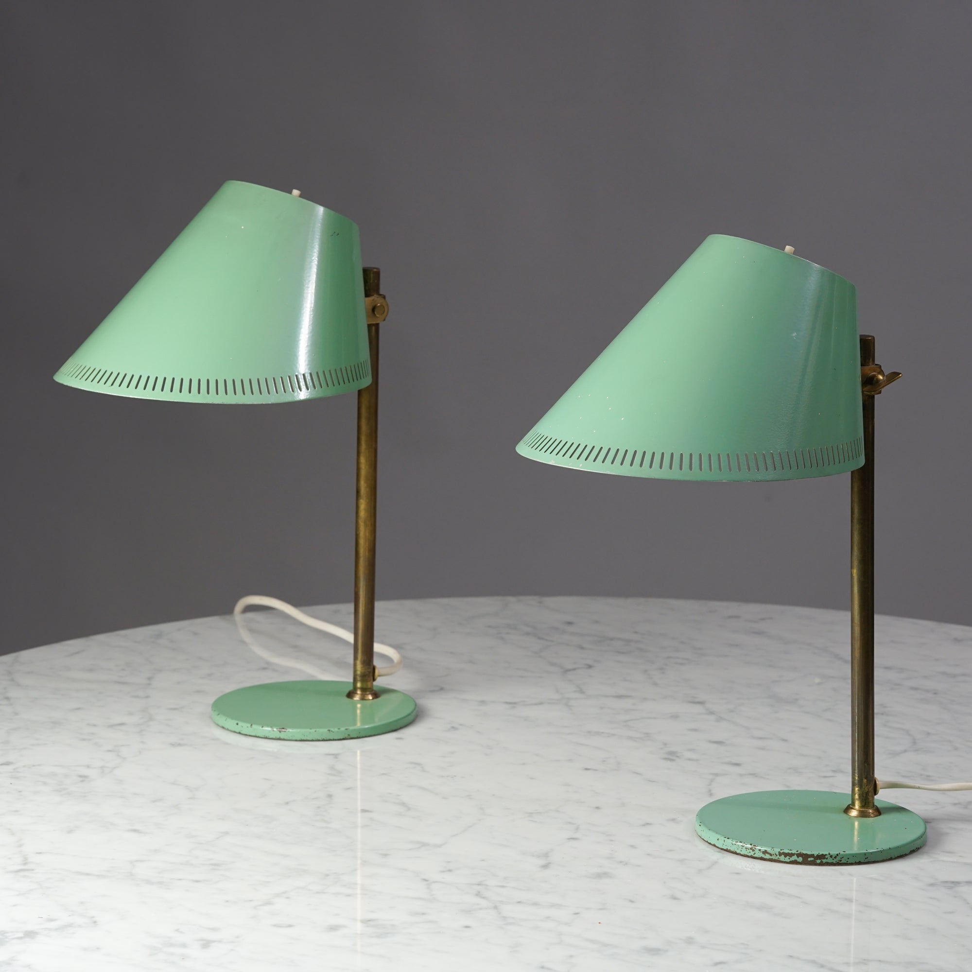 Set of '9227' Table lamps by Paavo Tynell for Taito Oy. Exceptionally rare and original green color. Marked Taito Oy / Idman. Produced in 1940s in Finland. This table lamp is one of the most iconic Tynell designs.

Beautiful patina.
 