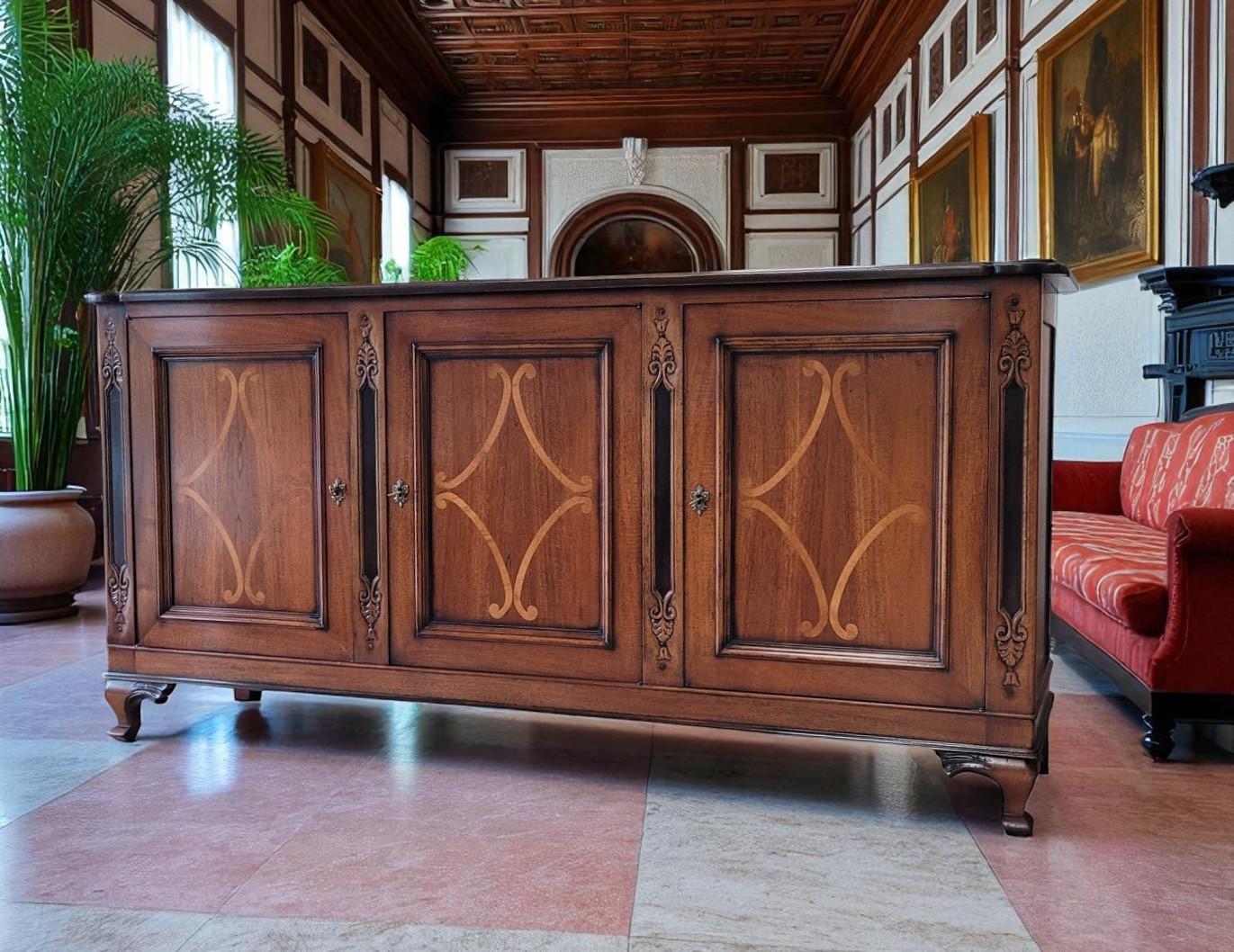 Discover the artistry of Italian furniture design with this exquisite sideboard by Giorgio Piotto, renowned for their commitment to timeless quality and traditional techniques. 

This substantial sideboard features a rich, warm wood finish that