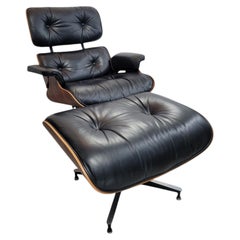 Fauteuil Eames Lounge Chair et repose-pieds Herman Miller d'origine, en palissandre du Brésil