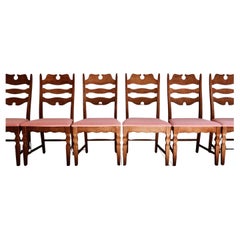 Antique Henning Kjærnulf razorblade dining chairs in oak and reupholstered seats