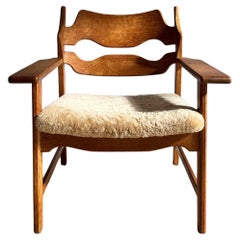 Henning Kjærnulf Razorblade lounge chair reupholstered in honey colored wool