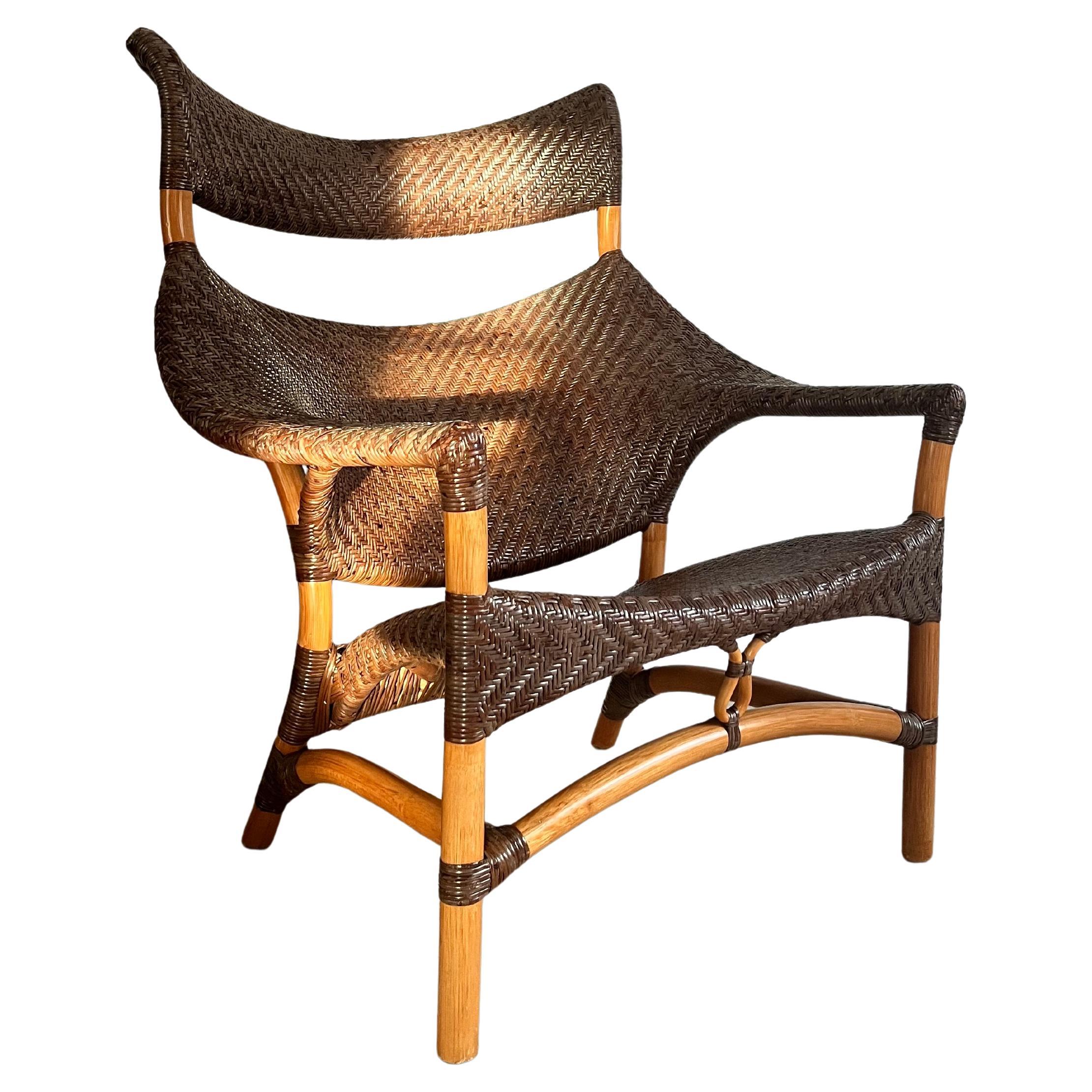Beautiful and functional ergonomic woven rattan/wicker chair, stool and table.

Designed by Yuzuru Yamakawa who shows his passion for the material and his life long work with designs in rattan.

Amazing condition and a rare 3-item piece - normally