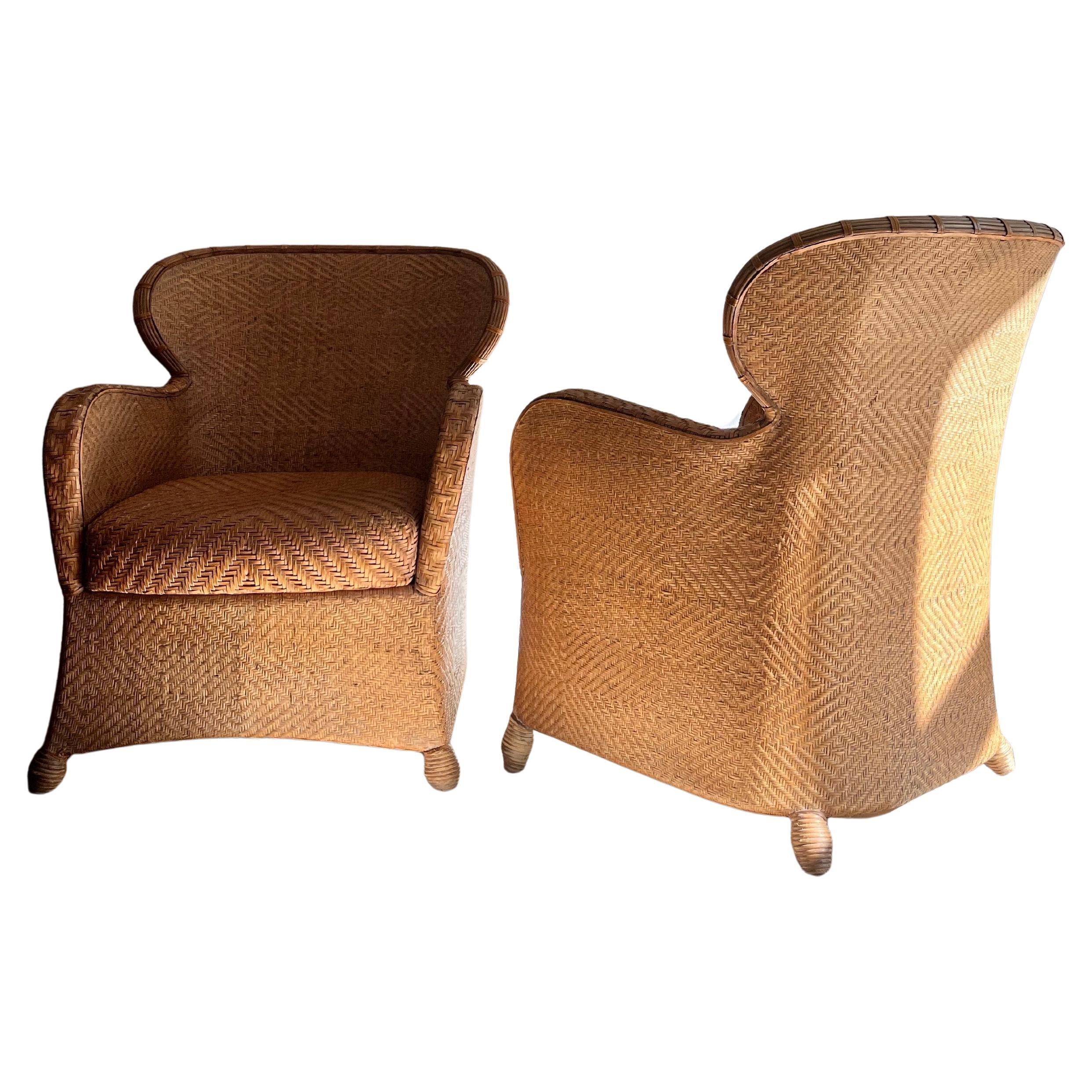 Set of two Danish Søren Lund armchairs from the 1960s.

Both chairs are in great condition and made of wicker and leather. The chairs themselves are in wicker while the armrests and cushions are in braided leather.

The large, soft cushion provides