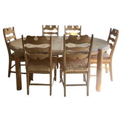 6 sillas de comedor Kjærnulf de roble y piel de oveja color miel retapizada.