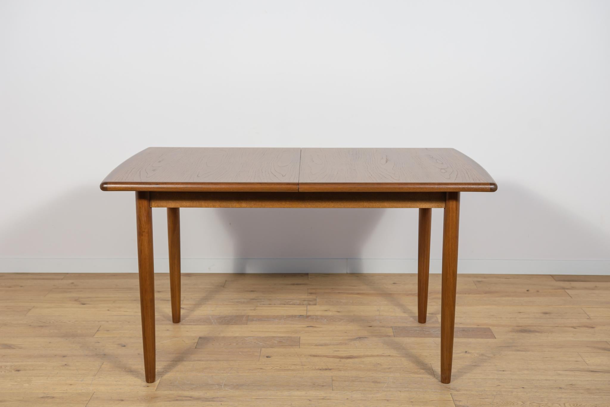 The extendable table was produced in the 1970s, in the British Meredew factory. The table has solid, profiled edges, which give it uniqueness and elegance. The rectangular teak table has undergone professional carpentry renovation. It has been