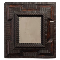 17th Century Italian Ebonised Ripple Framed Mirror