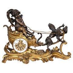 Rococo style clock with Louis XV monogram, gilt and patinated bronze