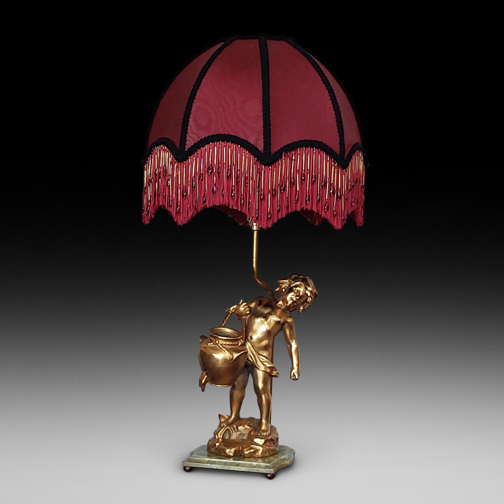 After Aug. Moreau, 19thC French Gilt Bronze Figural Lamp Base - in the form of a boy carrying a heavy water vessel, signed and with foundry mark medallion, on an onyx square base with ball - 14