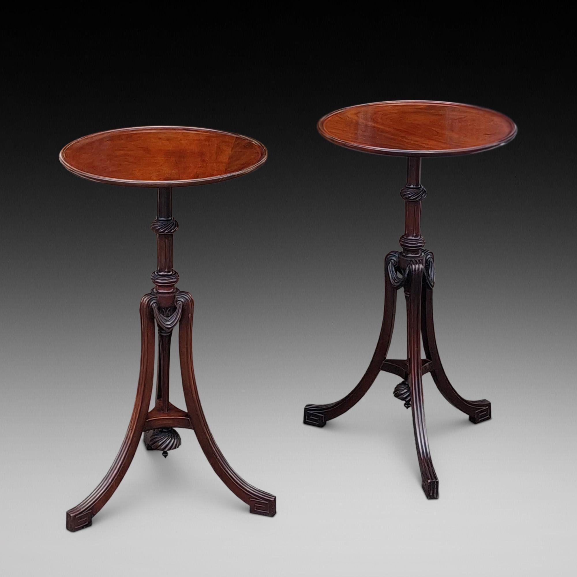Pair of late Victorian Mahogany Occasional Tables - with a circular top, raised on a turned and fluted column, slender fluted tripod legs with swag stretcher - 15.5
