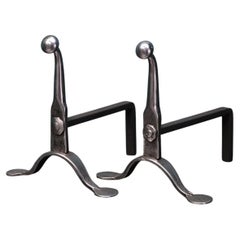 A Pair of English Mid-19th Century Polished Wrought Fire Dogs