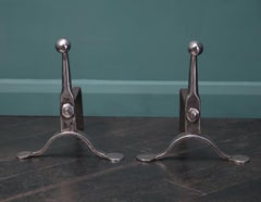 A Pair of English Mid-19th Century Polished Wrought Fire Dogs