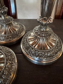 A set of four Sheffield silverplate candlesticks attributed to Matthew Boulton.