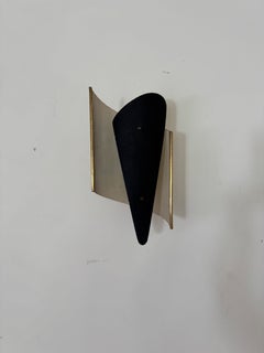 French 1950's white pierced and black metal wall light, attributed Jacques Biny