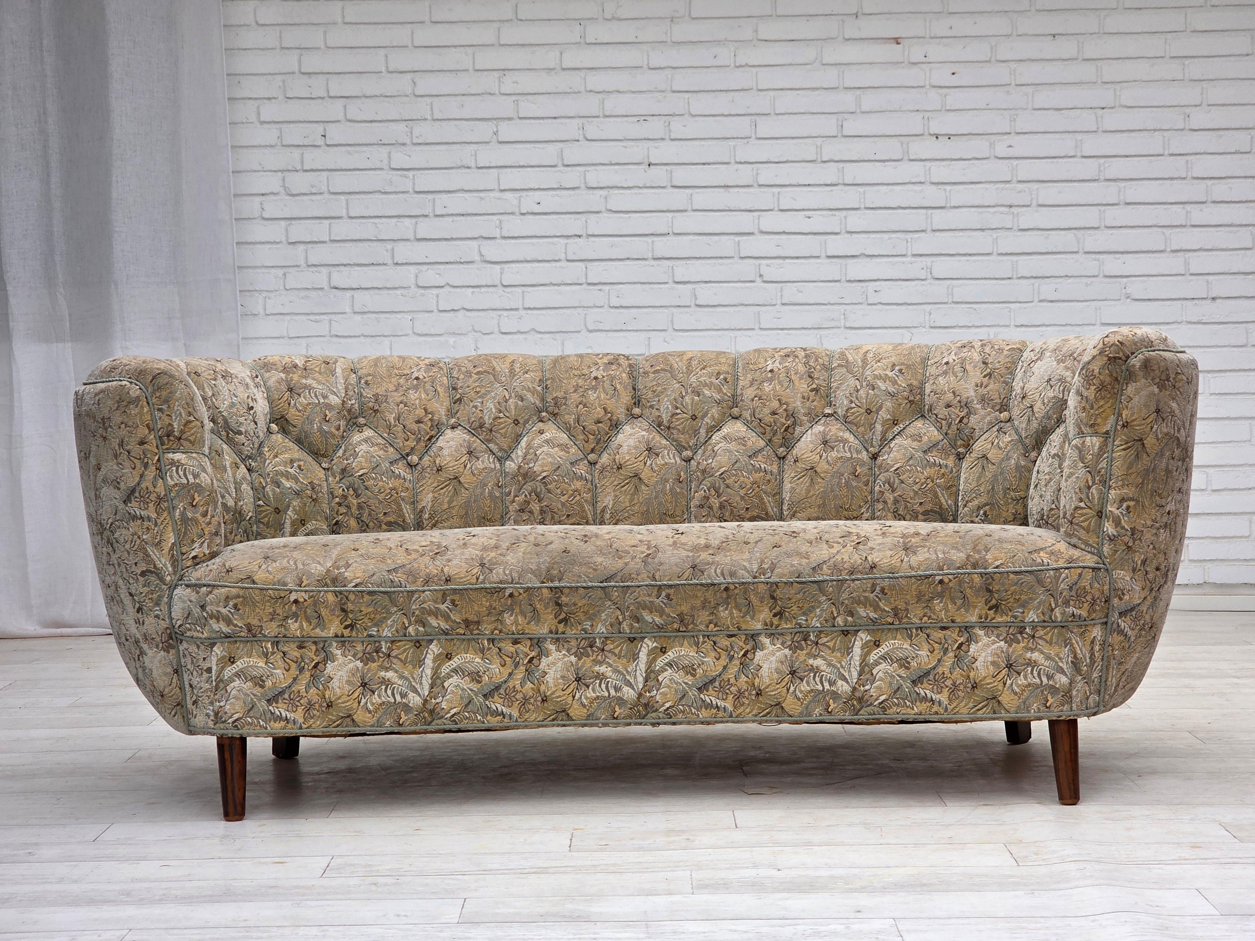 1970s, Danish 3 seater curved sofa. Original multicolor furniture fabric, beech wood legs, springs in the seat. Original good condition: no smells, no stains and stable construction. Manufactured by Danish furniture maker in about 1970s. Original