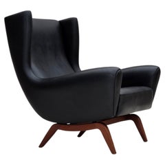 Anni '60, design danese di Illum Wikkelsø, poltrona, modello 110, pelle, legno di teak.