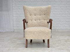1960s, Danish design by Alfred Christensen, reupholstered, genuine sheepskin.