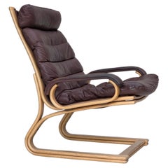 Anni '70, poltrona danese di Georg Thams, in pelle da arredamento e legno curvato.