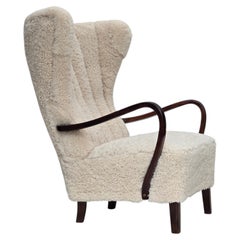 1960s, Danish high-back armchair, genuine sheepskin, reupholstered.