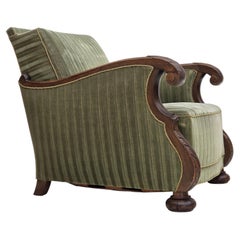 Anni '50, poltrona relax danese, velluto verde da arredamento, legno di quercia intagliato.