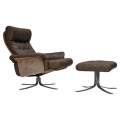 1970s, Danish swivel armchair with footstool, leather, stainless steel.