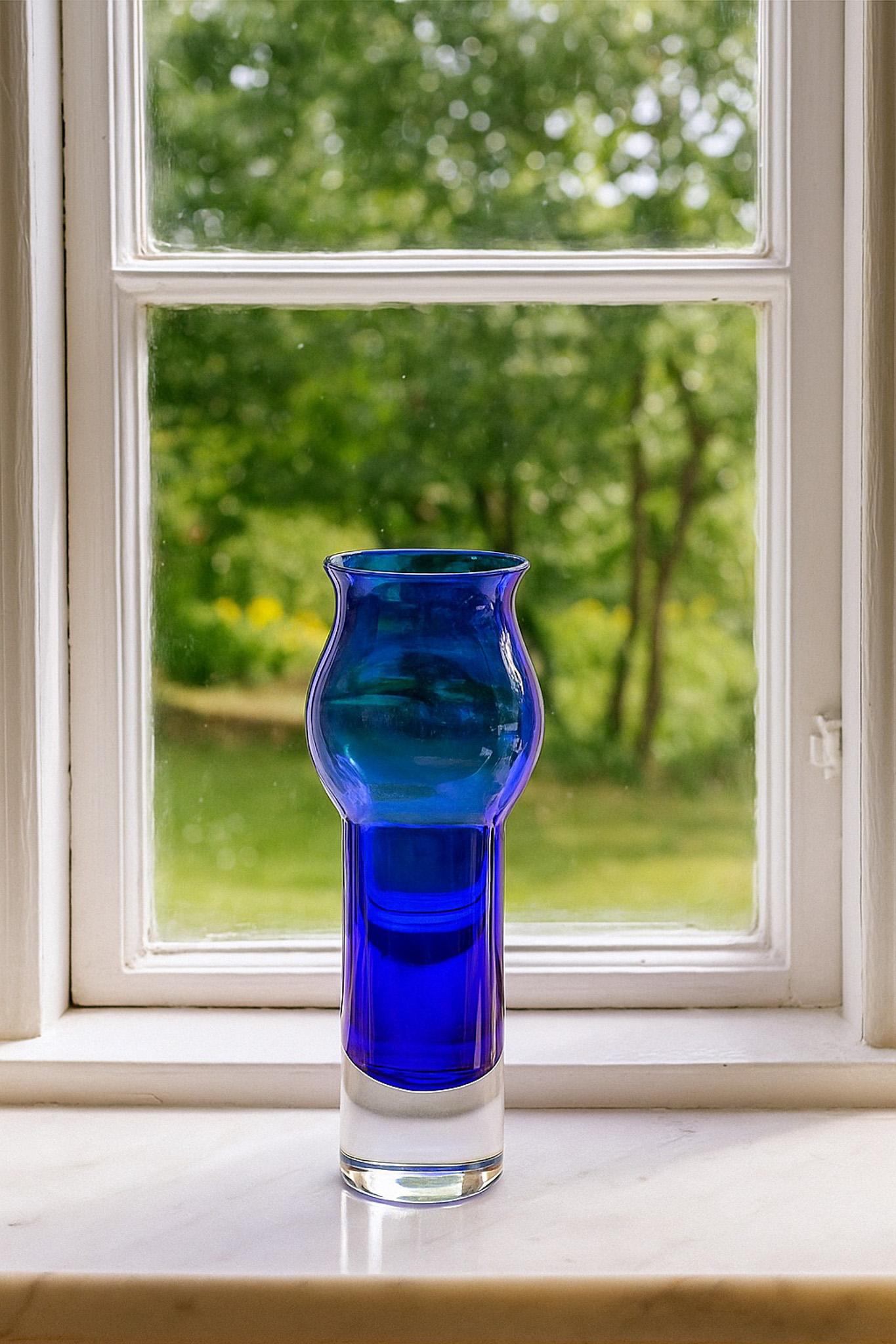 A large handblown blue sommerso vintage glass vases by Bo Borgström for Åseda, Sweden.  This is a very special vase, the color is a vibrant blue surrounded by clear crystal. It is very grand and yet also very simple and sophisticated and will be a