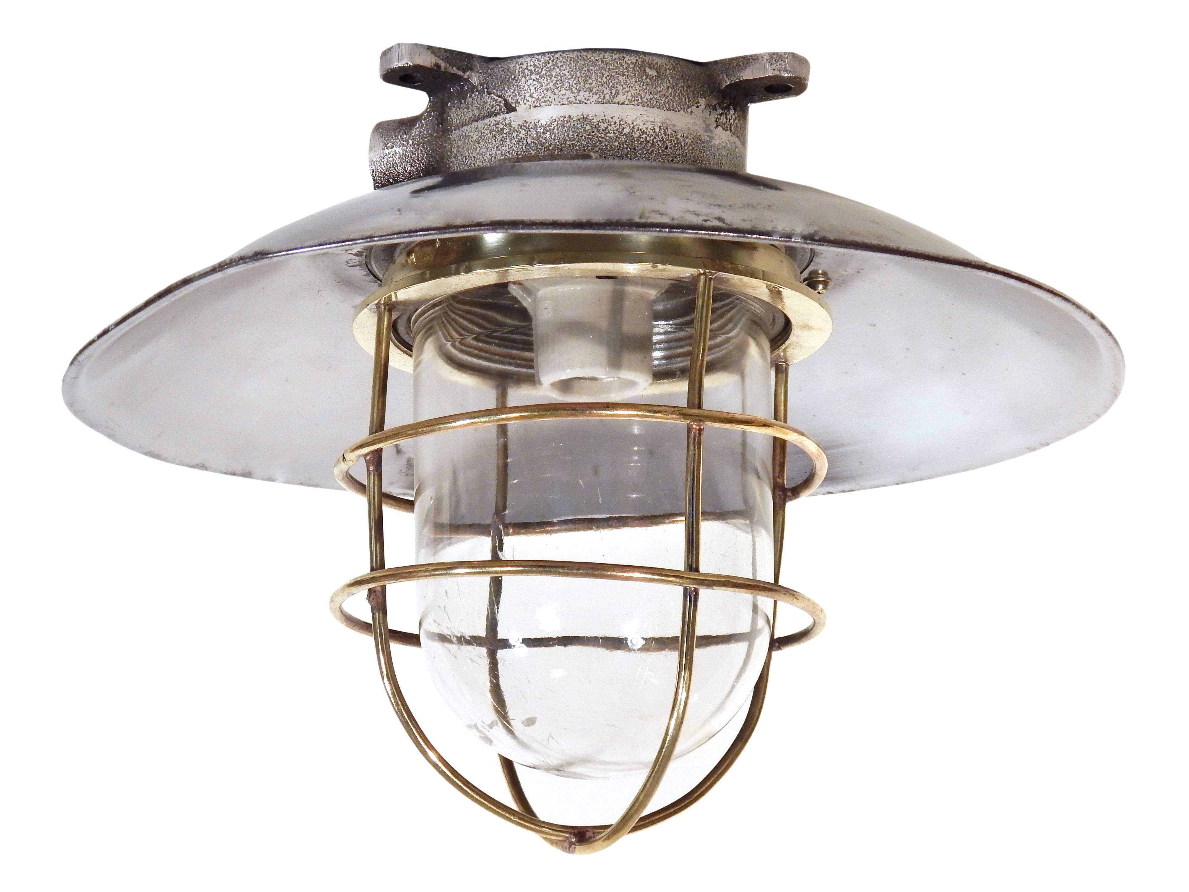 Nautical steel ceiling fixtures with brass cage and aluminum shade, priced individually.