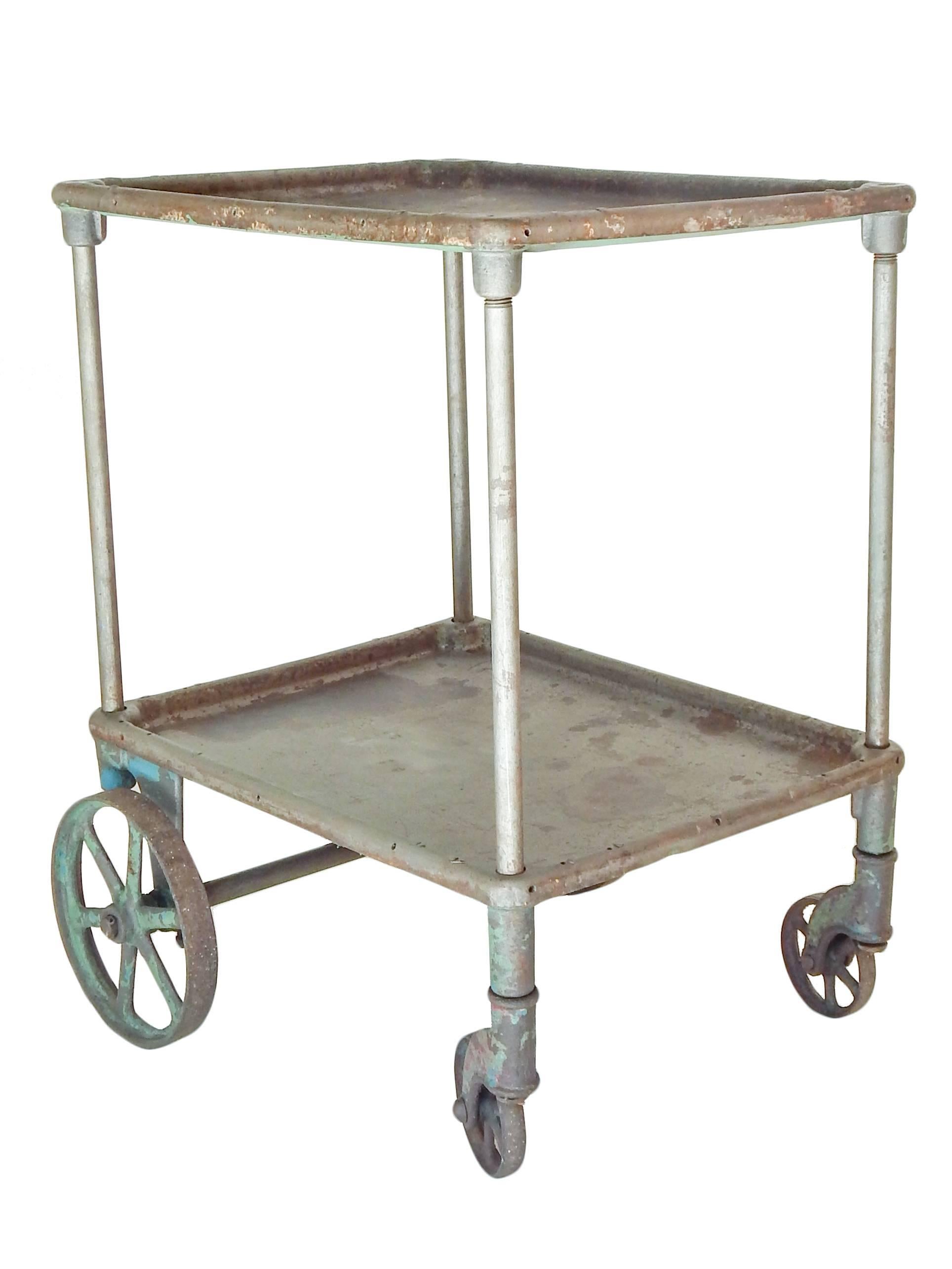 Industrial cart with remnants of old paint.