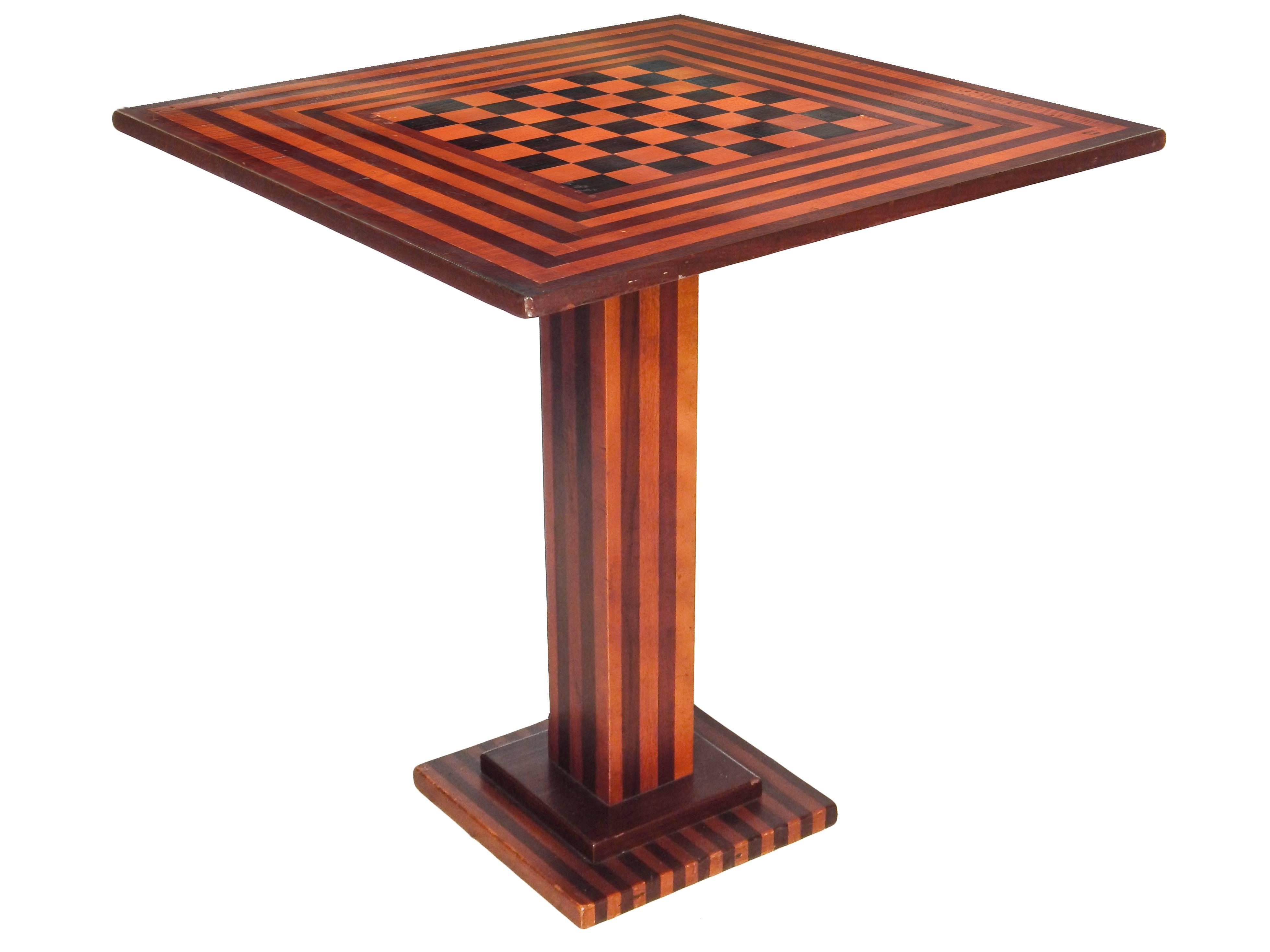 Handmade tilt-top checkerboard side/game table with trine base.
Measures: 39.5
